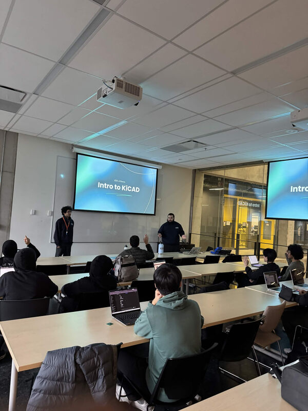 Adam presenting a workshop to a room of students